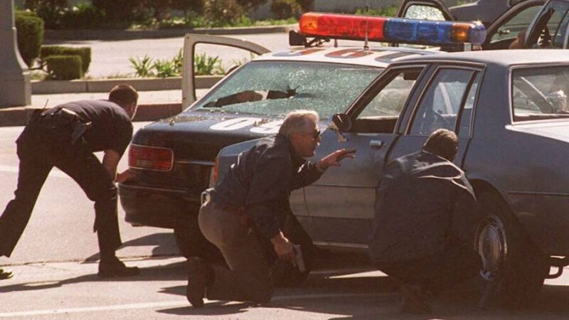 LAPD officers take cover during the 1997 North Hollywood Shootout, a turning point in modern policing.