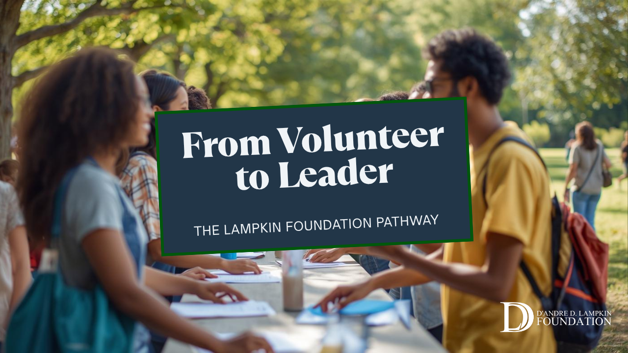 Diverse Lampkin Foundation volunteers coordinate a check-in table at a park event, greeting families and organizing badges.