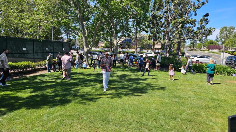 Children participating in Easter egg hunt at Creekside West Beach Club in Ontario California