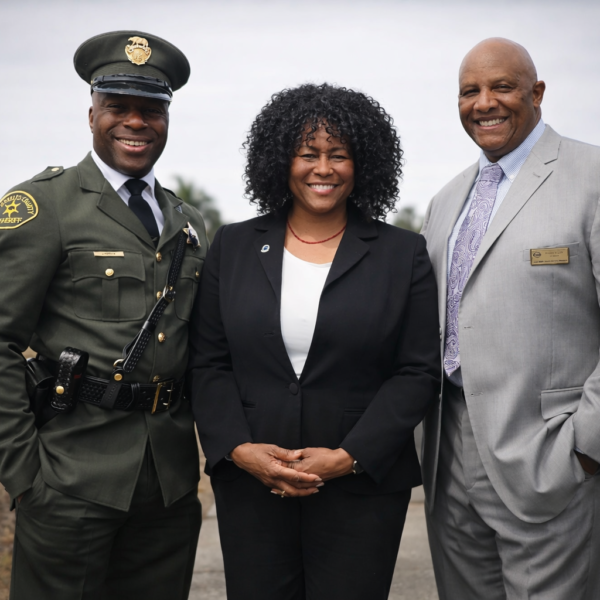 Deputy D’Andre Lampkin in Julius Boyd Loving replica uniform with Dr Chris Waters NOBLE and Robert Knight First AME Church at Los Angeles ceremony