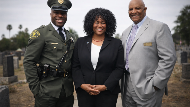 Deputy D’Andre Lampkin in Julius Boyd Loving replica uniform with Dr Chris Waters NOBLE and Robert Knight First AME Church at Los Angeles ceremony
