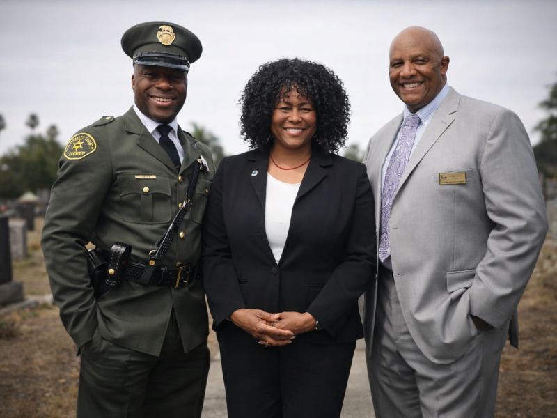 Deputy D’Andre Lampkin in Julius Boyd Loving replica uniform with Dr Chris Waters NOBLE and Robert Knight First AME Church at Los Angeles ceremony