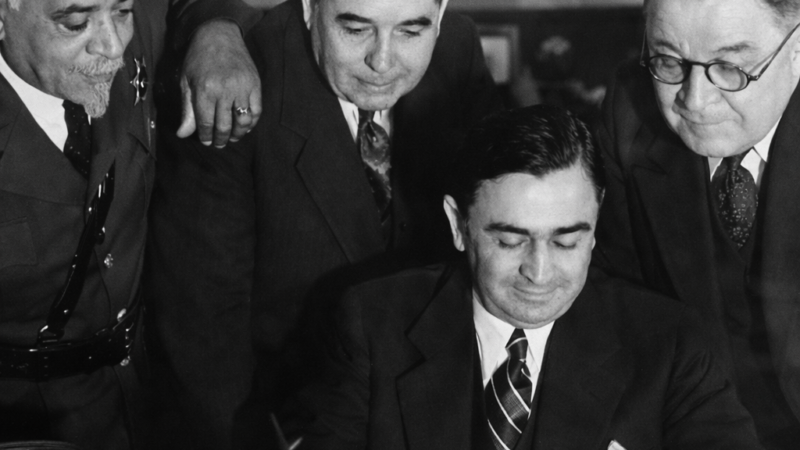 Deputy Julius Boyd Loving with Los Angeles County Sheriff Eugene Biscailuz reviewing documents, early 20th century