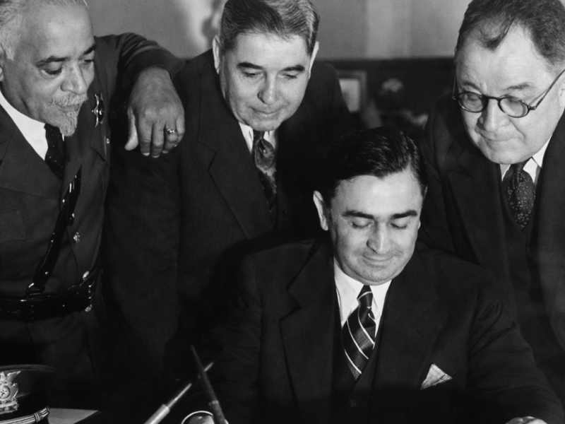 Deputy Julius Boyd Loving with Los Angeles County Sheriff Eugene Biscailuz reviewing documents, early 20th century