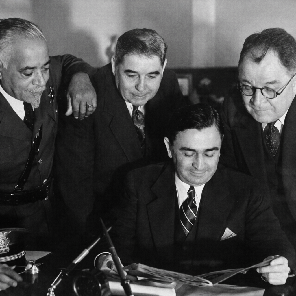 Deputy Julius Boyd Loving with Los Angeles County Sheriff Eugene Biscailuz reviewing documents, early 20th century
